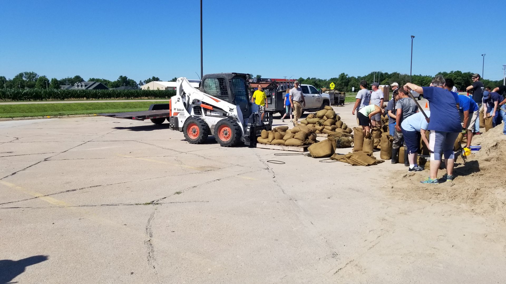 Volunteers fill sandbags in Wood River